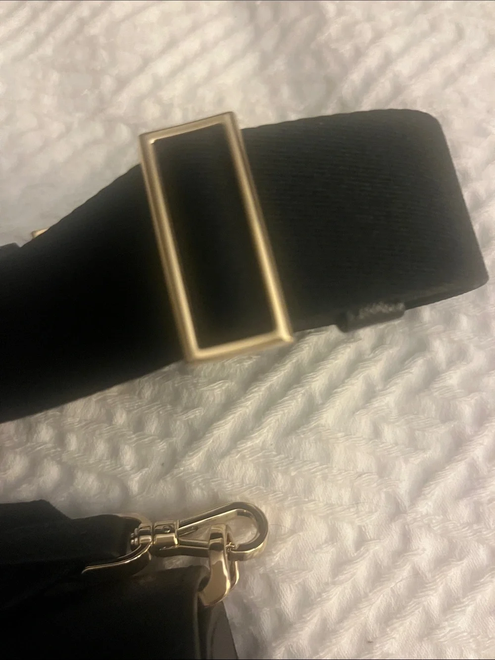 Kate Spade black crossbody saddlebag with gold logo